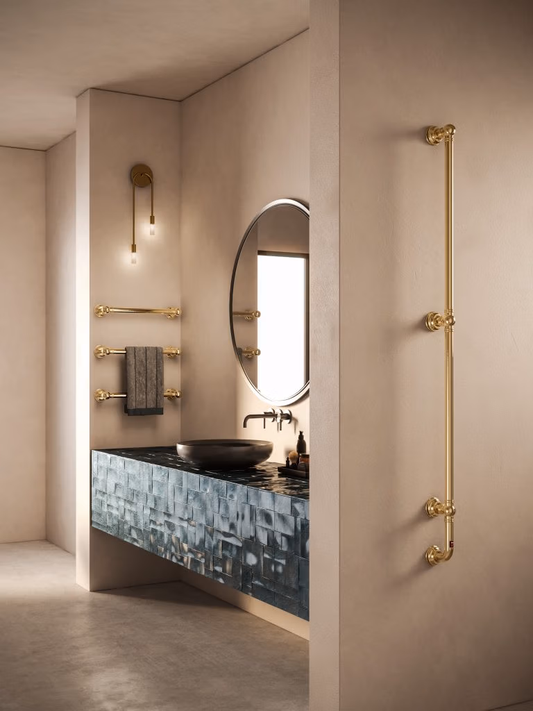 A modern bathroom showcasing a gold sink and a mirror, highlighting a luxurious design aesthetic.