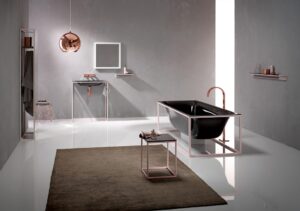 Modern bathroom with black tub, copper fixtures, and minimalist design. Open shelving, geometric lines, soft lighting, and a reflective copper pendant lamp.