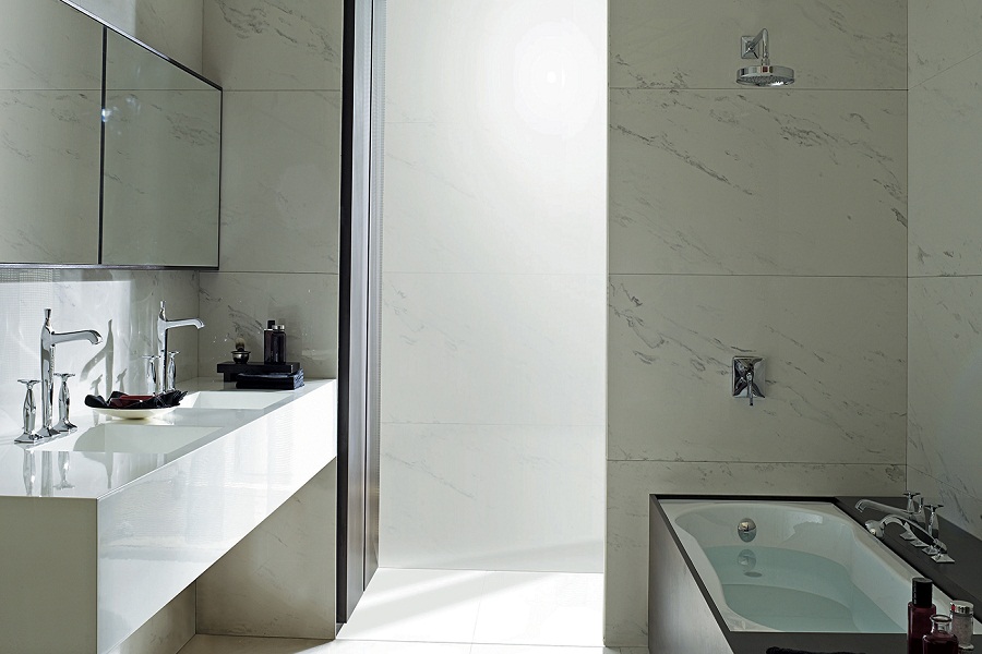 Modern bathroom with marble walls, sleek double sink, mirrored cabinet, and black-accented bathtub under soft natural lighting. Minimalist and elegant design.