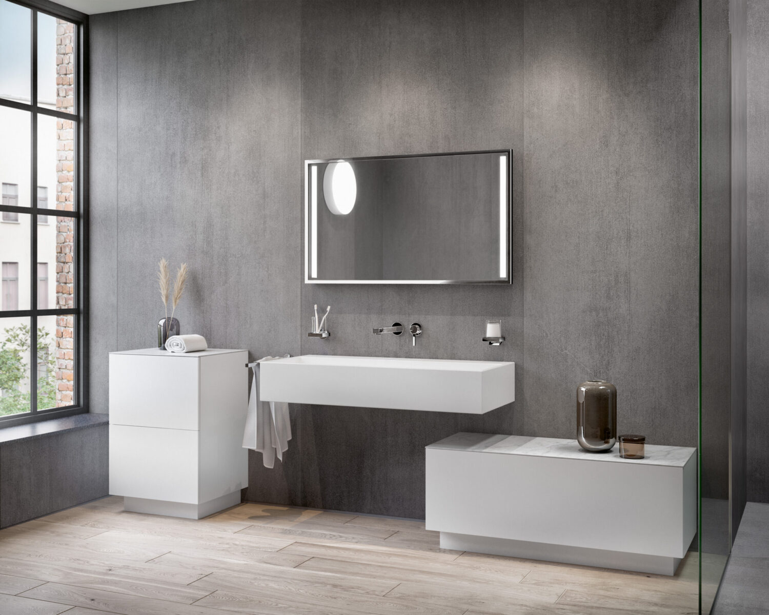 Modern bathroom with minimalist design: floating sink, large mirror, gray walls, natural light from a window, white cabinets, and decorative items.