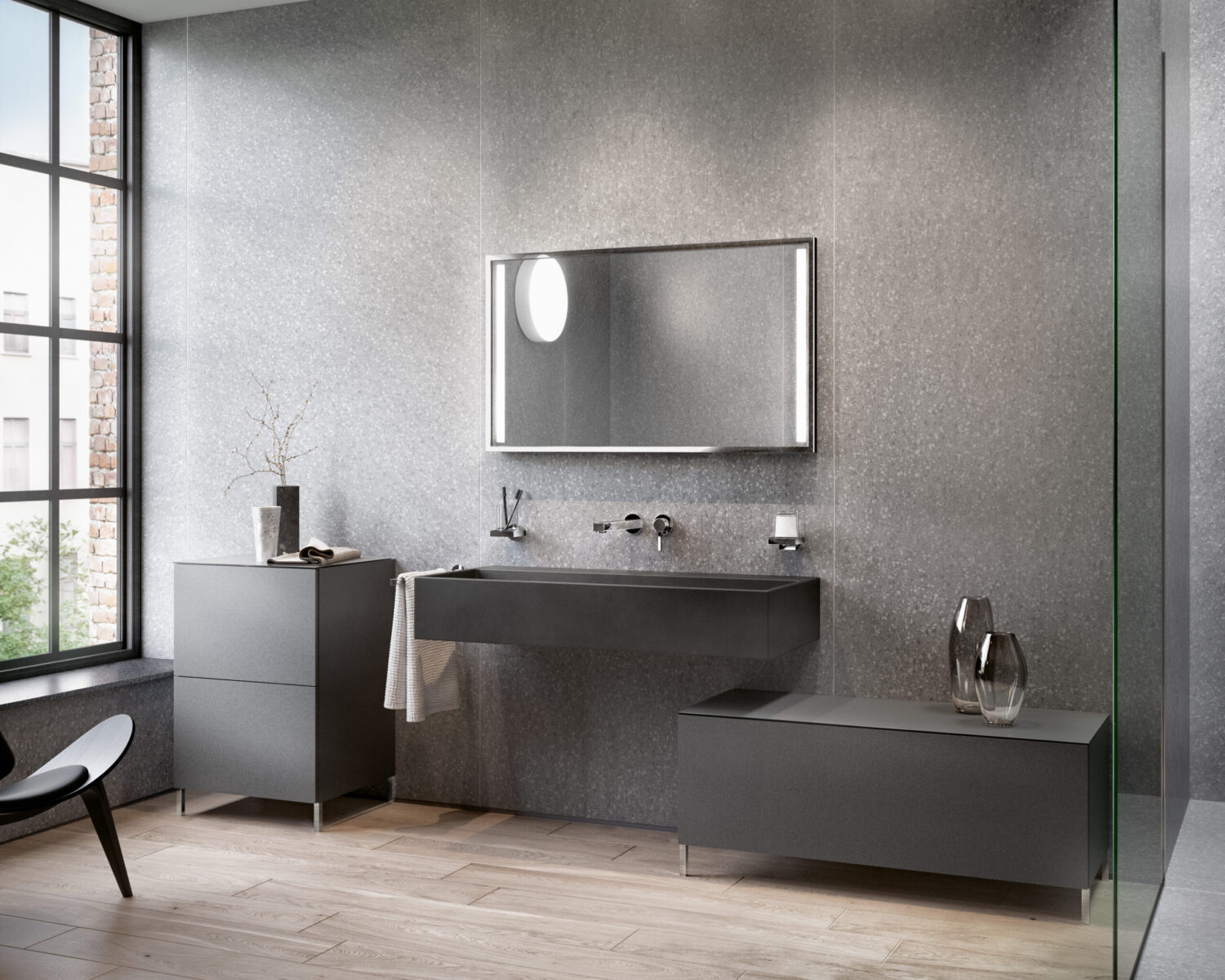 Modern bathroom with sleek gray fixtures, large mirror, and wooden floor. A large window allows natural light to illuminate the contemporary design.