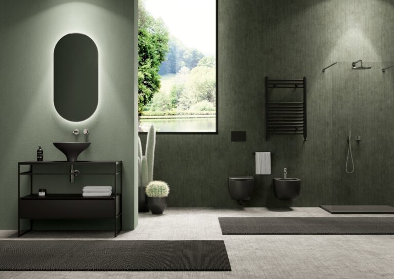 A green bathroom with black toilet and basin from Alice Ceramica