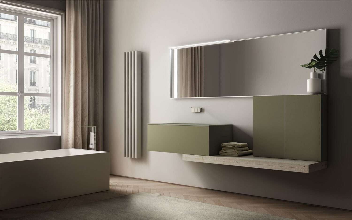 Minimalistic bathroom features a freestanding bathtub, large mirror, and floating green cabinets. Natural light filters through window with classic urban backdrop.