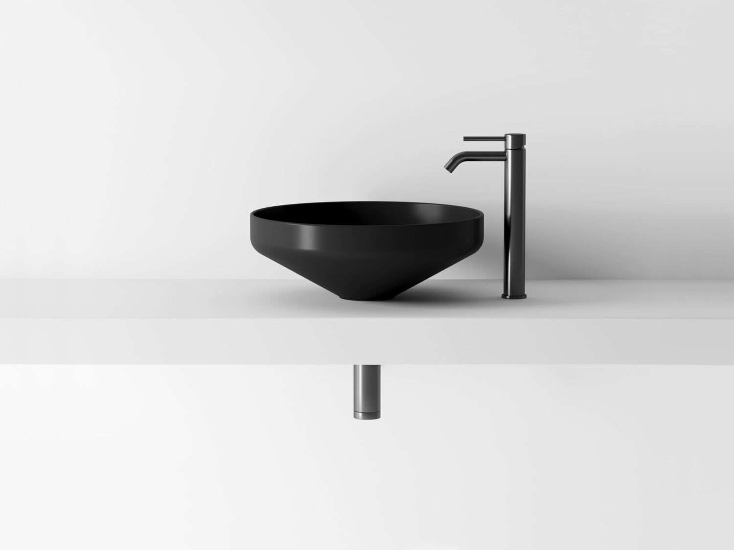 A minimalist black sink with a sleek faucet on a white countertop against a plain background, showcasing modern bathroom design.