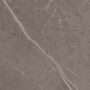 Marble surface displaying natural veining patterns and tones of gray. The texture is smooth and suitable for architectural and interior design applications.