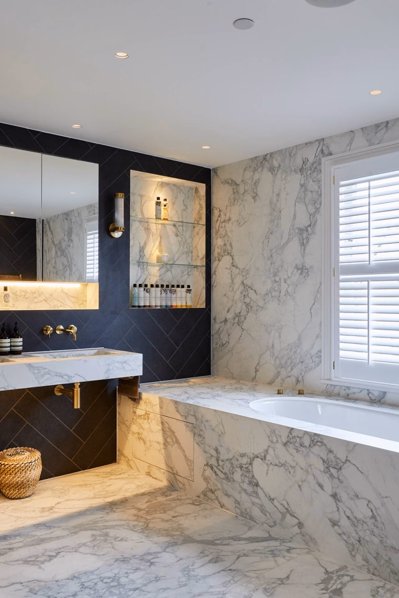 Luxury bathroom with white marble tiles and blue tiles
