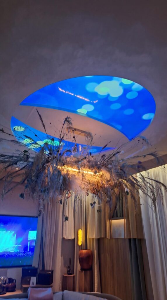 Dramatic dried botanical ceiling installation with LED skylight at WOW!house 2026 Design Centre Chelsea Harbour.