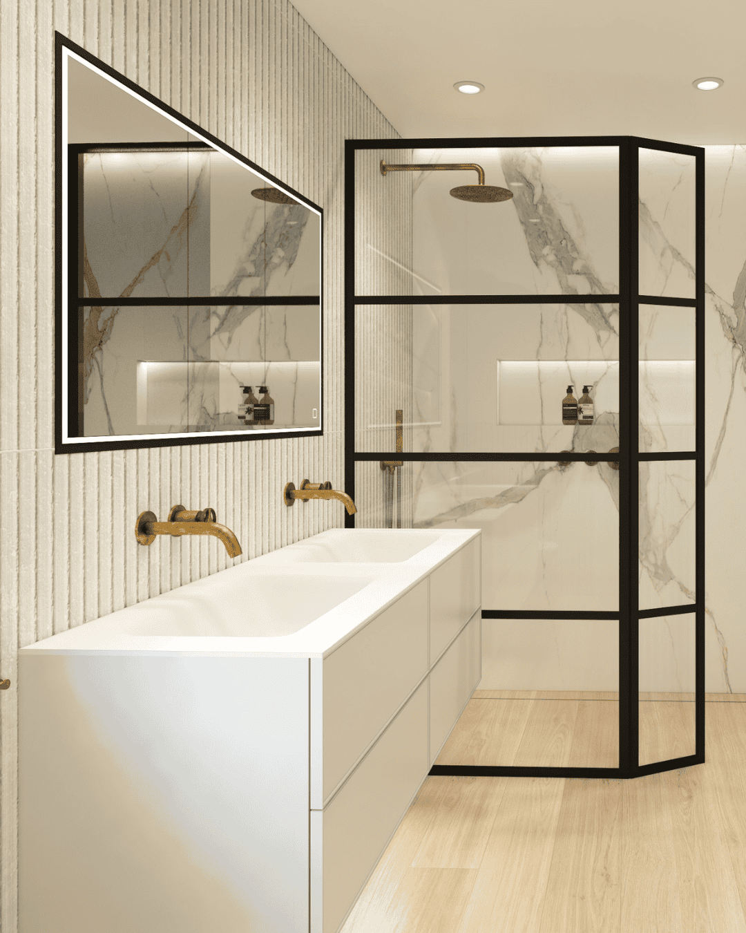 Modern bathroom with marble walls, gold fixtures, and a glass shower screen.