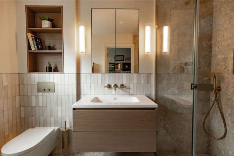 Modern Victorian bathroom with floating vanity and walk-in shower.