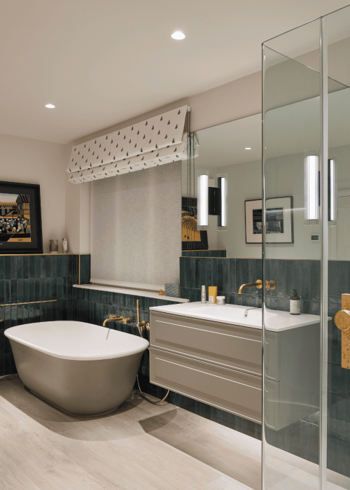 Modern bathroom with freestanding tub, glass shower, and elegant decor.