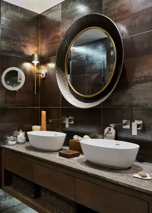 Double vessel sinks with modern fixtures in a stylish bathroom setting.
