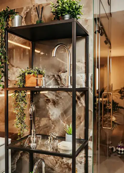 Industrial kitchen shelving unit with plants, sink, and fixtures.