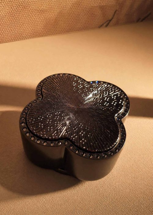 Elegant black decorative trinket box with intricate design, perfect for bathroom or bedroom storage.