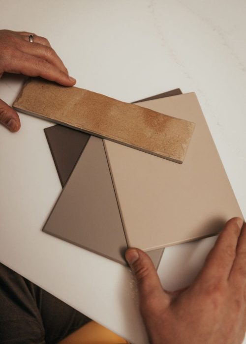 Selecting neutral bathroom tiles for a modern bathroom design.