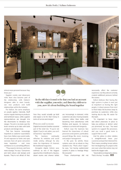 Modern bathroom with dual sinks, green paneling, and artistic wall mural at Kallums Bathrooms.