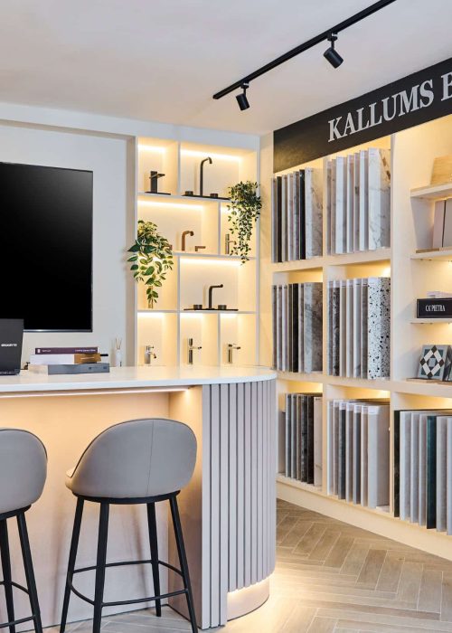 Kallums Bathrooms showroom with display shelves of bathroom tiles and a reception area.