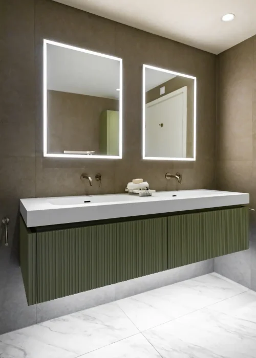 Modern bathroom with double illuminated mirrors and green vanity unit.