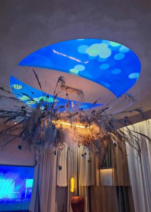 Dramatic dried botanical ceiling installation with LED skylight at WOW!house 2026 Design Centre Chelsea Harbour.