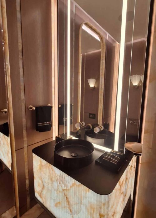Backlit onyx vanity with matte black basin at WOW!house 2026, Design Centre Chelsea Harbour.